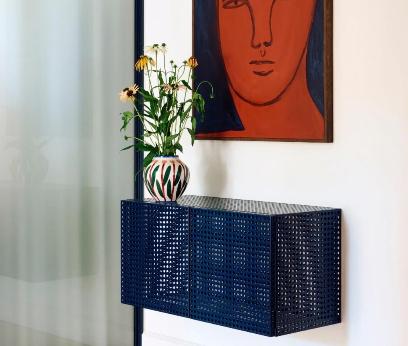 Colored perforated metal wall-mounted sideboard by Hay